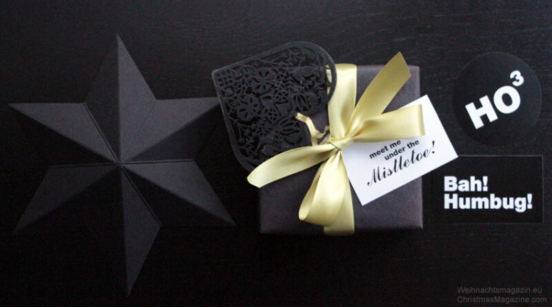 present wrapped black, satin ribbon, black paper star, gift tags