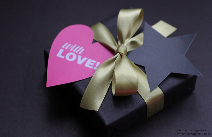 gift wrapped in black with pink heart gift tag