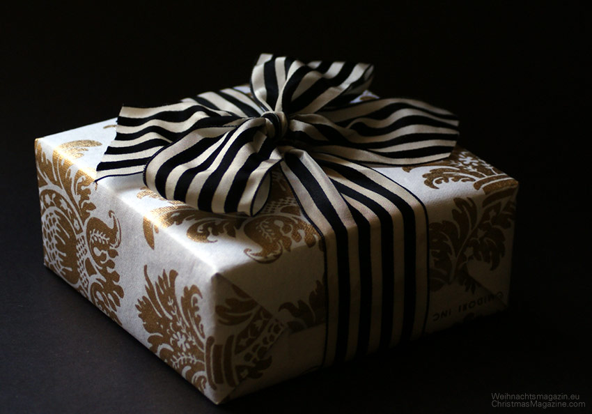 gift wrapping with contrasting packaging, paper with gold brocade pineapple print