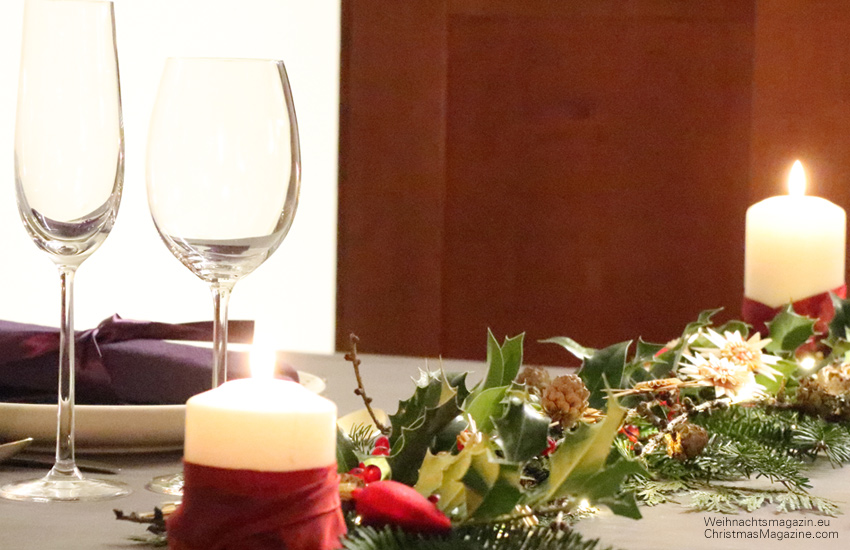 straw stars, pinecones, traditional German Christmas table setting, candle wrapped with ribbon