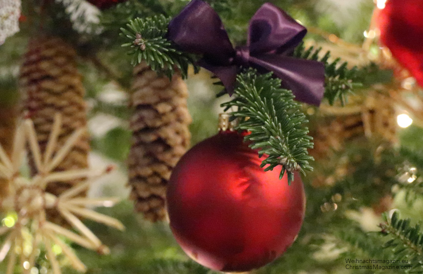 decorated Christmas tree,  purple bow, red bauble