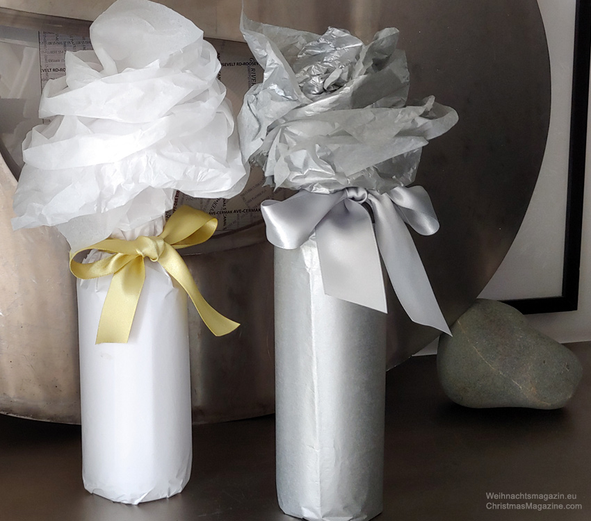bottles wrapped with tissue paper, white and silver
