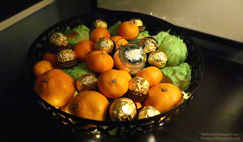fruit bowl with fairy lights and mandarin oranges, ferrero rocher