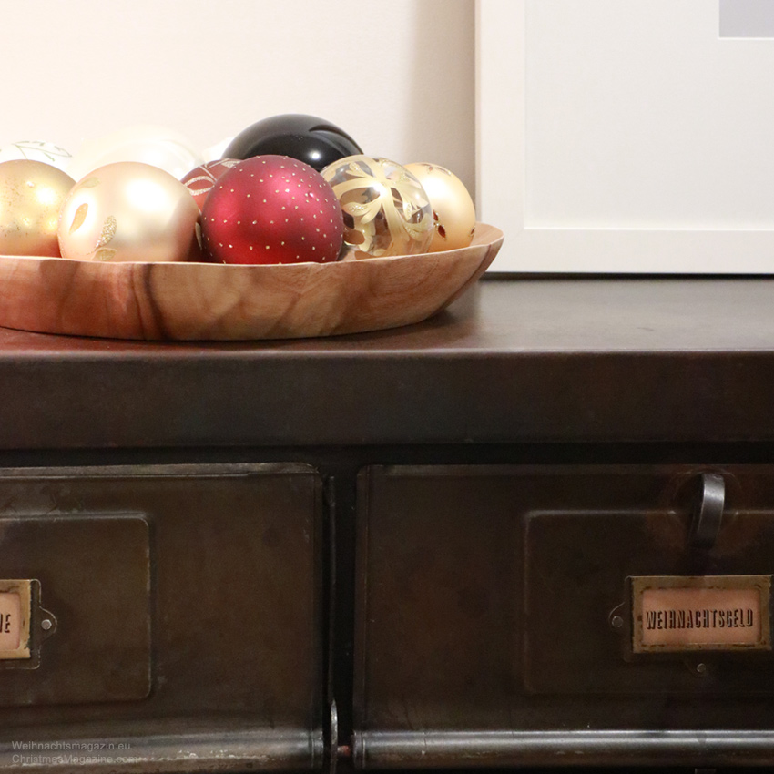 Christmas baubles, red, gold, white, wooden platter