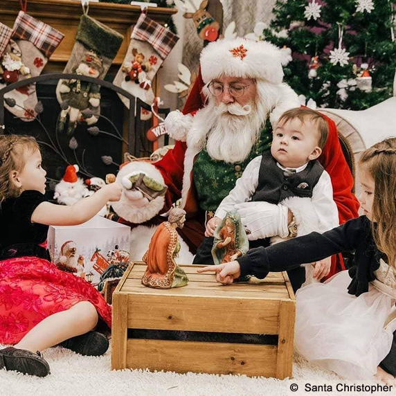 Santa Christopher with children and Nativity Scene