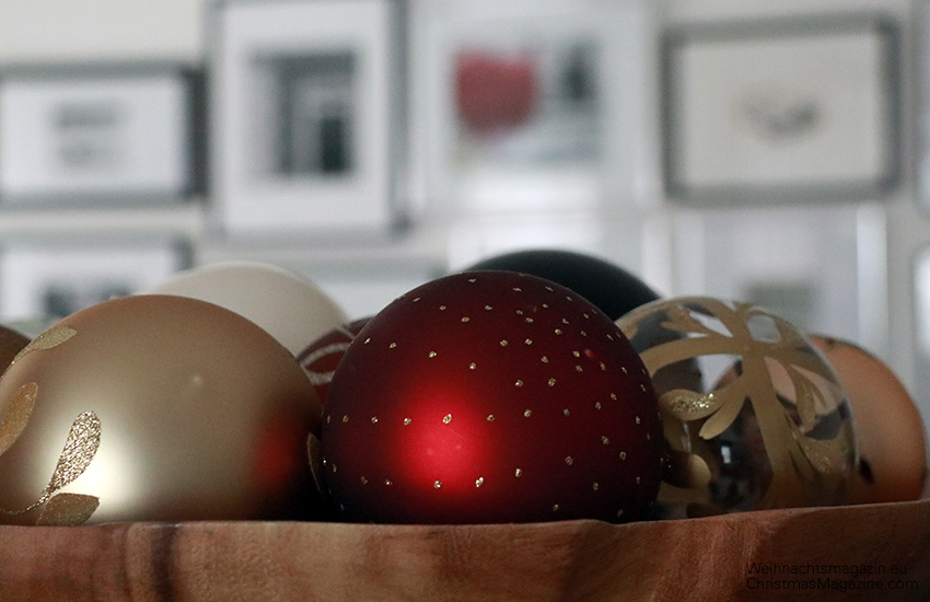 Christmas ornaments on wooden platter, display