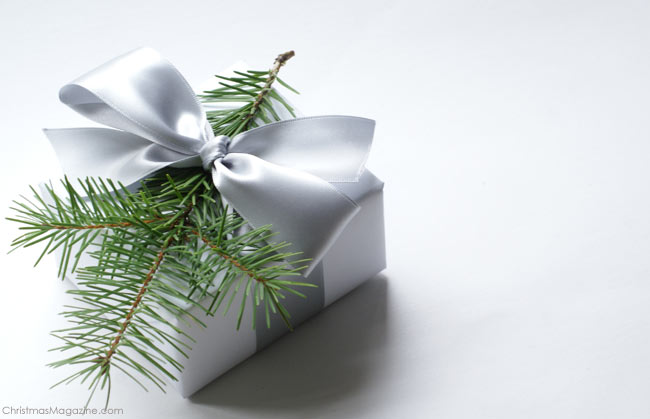 Christmas gift wrapping, satin ribbon, tree sprig