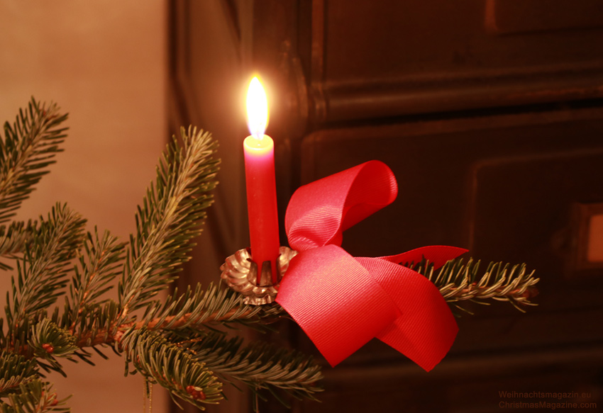 Christmas tree with red candle and bow