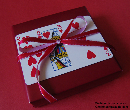 present adorned with playing cards