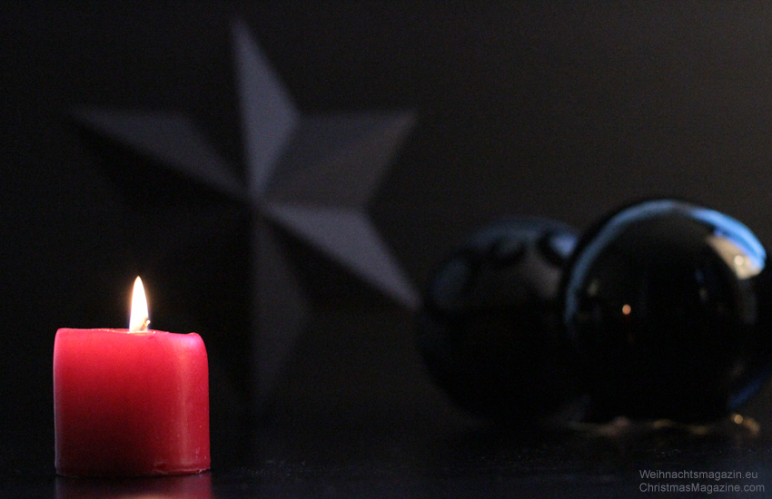 red candle with black star